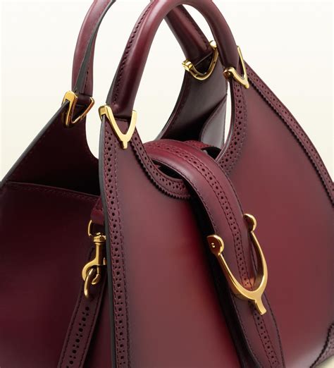 gucci purple stirrup bordeaux leather top handle bag|gucci purses for women.